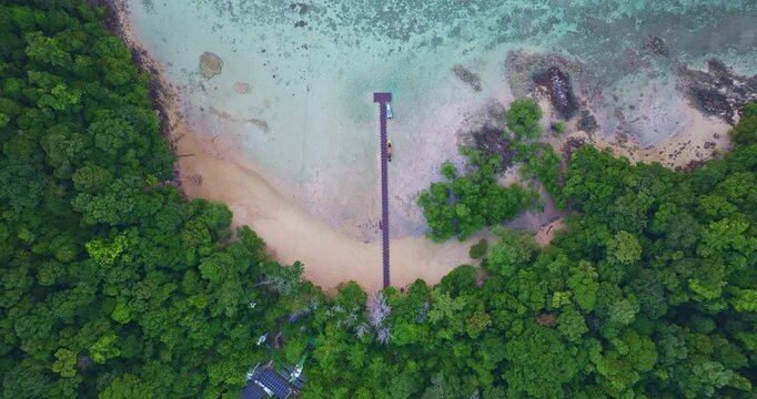 An amazing bird's eye view of Ao Mai Ngam, Surin Islands. There is a pier opposite the beach where the accommodation is. There are coral reefs and schools of fish. It is a destination for divers.