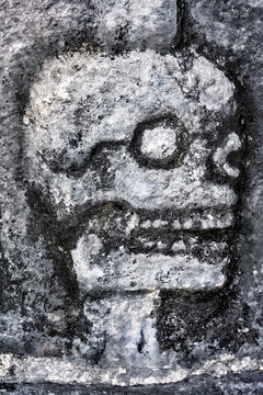 Detail of Tzompantli of Chichen Itza, wall of skulls, is dedicated to the dead. Habitants of Chichen Itza would gather long wooden beams in which they would hang their enemies' heads.