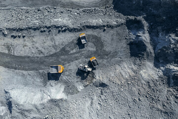Open pit mine, extractive industry for coal, top view aerial drone.
