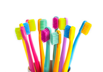 A set of multicolored toothbrushes isolated on white background. Design concept for dental and oral...