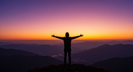 Fototapeta premium Silhouette of Person with Arms Out at Sunset (Photo)