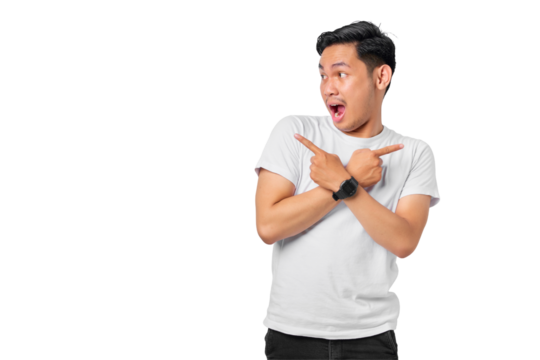 Shocked young Asian man crossed arms and points sideways, chooses between two options, indicates left and right isolated on transparent background