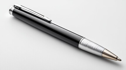 A sleek black ballpoint pen with a metallic tip and clip rests on a white surface.