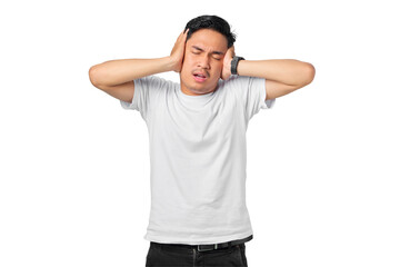 Fototapeta premium Frustrated young Asian man covering ears with hands and keeping eyes closed isolated on transparent background