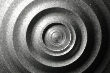 Subtle grayscale gradient forming concentric circles, pattern, geometric