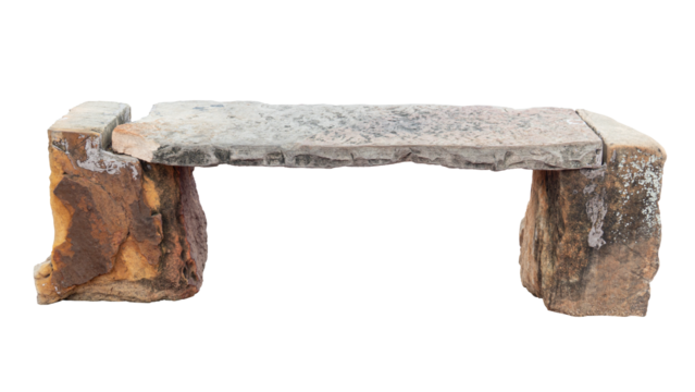 Side view of chaise lounge made from stones. Two large stone legs and a long, large stone slab for sitting on.