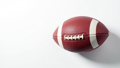 Fototapeta premium Overhead view of perfectly aligned football on white background , sport, oval