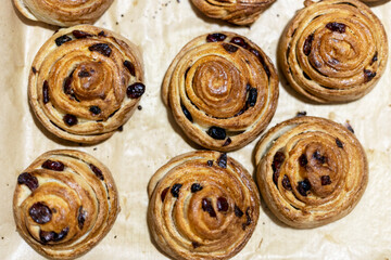 Freshly made cranberry and cinnamon buns, top view.