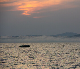 fishing boat at sunset