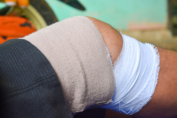 Close up of a bandaged leg after an accident while working in construction