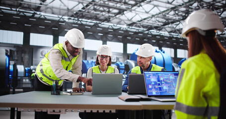 Skilled Technician And Young Engineer Monitor Automated Powerplant Operations