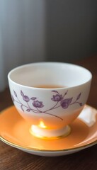 Fototapeta premium cup of tea on a saucer on a table
