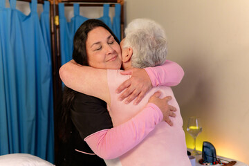 Nurse embracing senior patient, providing comfort and support in a healthcare setting
