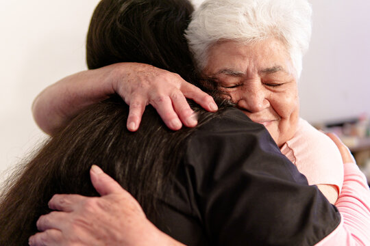 Heartwarming moment of connection between a nurse and her elderly patient, highlighting the importance of compassion in healthcare