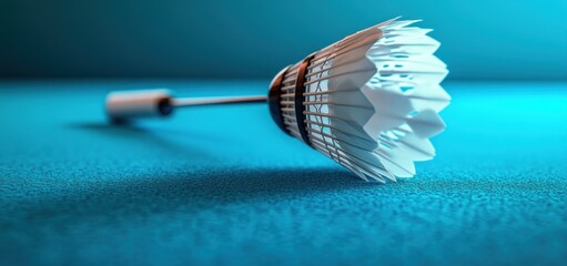 Close-up of a Shuttlecock on a Blue Surface: Badminton Equipment