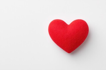 Fototapeta premium minimalist image showcasing single red heart on plain white background