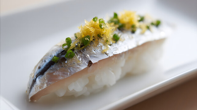 Delicious Nigiri Sushi with Marinated Mackerel and Fresh Garnish on a White Serving Plate