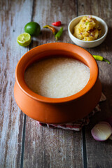 Panta bhat is fermented soaked rice, typically served with mashed potatoes (alu seddho), offering a tangy, comforting, and nutritious dish popular in Bengali cuisine.
