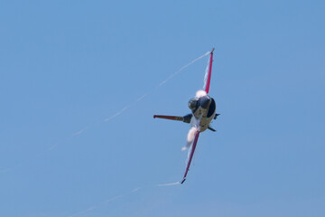 Close view of a F-16 Fighting Falcon in a high G maneuver, with condensation streaks at the wing...