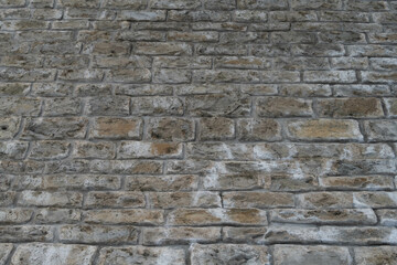 Obraz premium Un vieux mur voûté en pierre taillée, témoin silencieux du passé