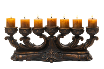 Ornate candle holder with seven lit candles dark background