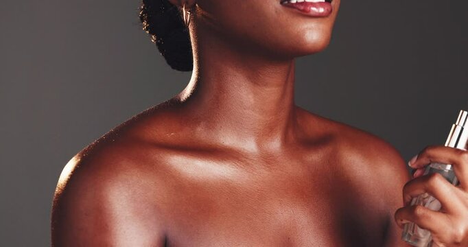 Perfume, spray and hand with black woman for beauty, skincare and aesthetic on studio background. Neck, mist and model with body product, parfume and essence for luxury smell and fragrance