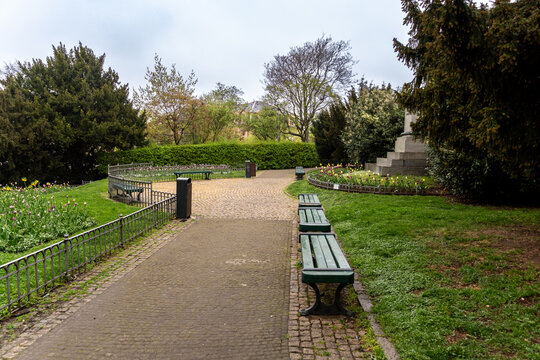 Wooden benches and path in Riegrovy sady park in the center of Prague.