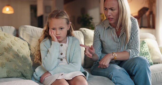 Discipline, mother and lecture child on sofa for bad behavior, attitude problem and punishment for tantrum. Angry woman, conflict and reprimand girl kid in home with fight, teaching manners or advice