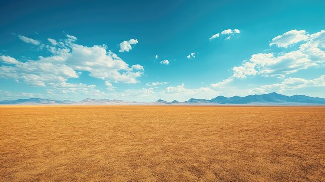 Expansive desert landscape under a vibrant blue sky.