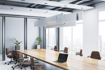 Modern corporate boardroom with wooden table, office chairs, laptop, large windows, city view, glass partitions, and contemporary lighting. 3D Rendering