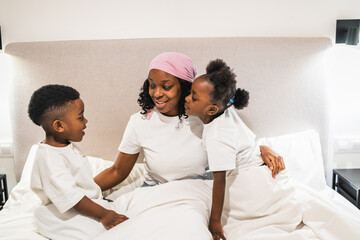 Two children with their sick mother fighting cancer, showing love and support during a challenging...