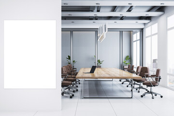 Vertical white poster frame on modern office wall with conference room interior, large wooden table, chairs, and city view through big windows. 3D Rendering