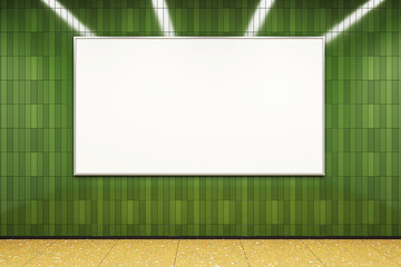 Blank billboard on green tiled wall with yellow floor in metro station under ceiling lights, clean...