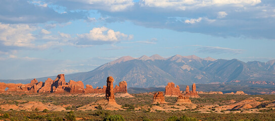 Panoramic view of the amazing landscape and formations at Arches National Park at Sunset.