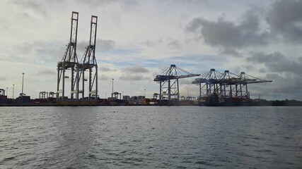 A view from metro boat shows Ship to shore container cranes or Ship to shore gantry crane in port