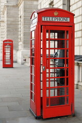 Fototapeta premium Traditional British red telephone box on a London street
