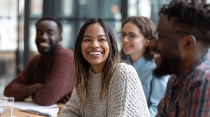 Fototapeta premium Diverse group of colleagues smile at a business meeting