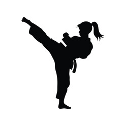 Silhouette of a Martial arts lady karate athlete performing a high kick
