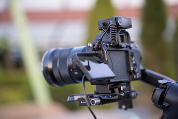 Camera setup for outdoor photography session in a lush garden setting