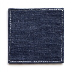 Isolated blue denim patch offering a textured square shape and detailed stitching