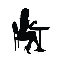 Fototapeta premium Silhouette of a woman sitting at a table enjoying a cup of coffee