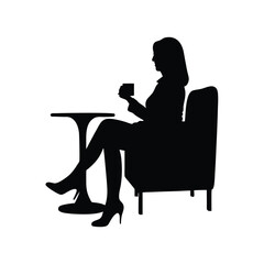Silhouette of a woman sitting at a table enjoying a cup of coffee