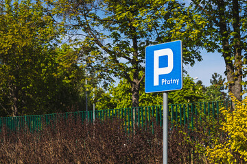 Paid Parking Sign in Urban Green Zone