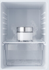 A refrigerated cream jar is surrounded by frost inside a white refrigerator