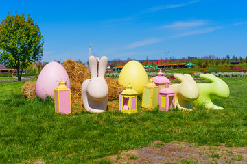 Colorful Easter Decorations Featuring Bunnies And Eggs On Grass