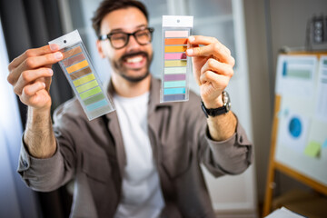 Man selecting the perfect color from a palette for a project.