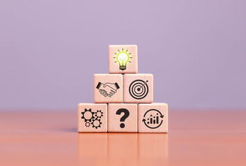 Innovation and inspiration concept, creative light bulb wooden block with industry and marketing development network icons, strategic planning, modern business and inspiration, innovation concept