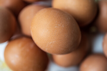 Macro shot of brown eggs pile.