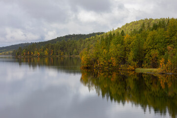 Beautiful autumn landscape with the fog and river . Russia