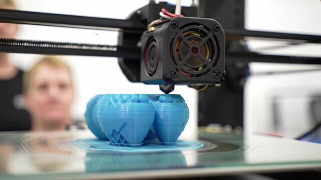Exploring the process of 3D printing in a creative workspace in the afternoon